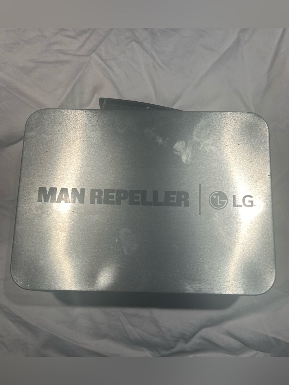 MAN REPELLER x LG tin lunchbox
